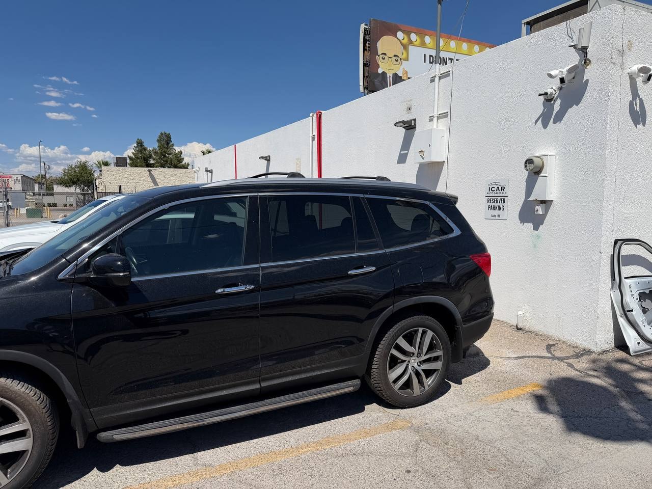 Black Honda Pilot side view at ICar Auto Sales